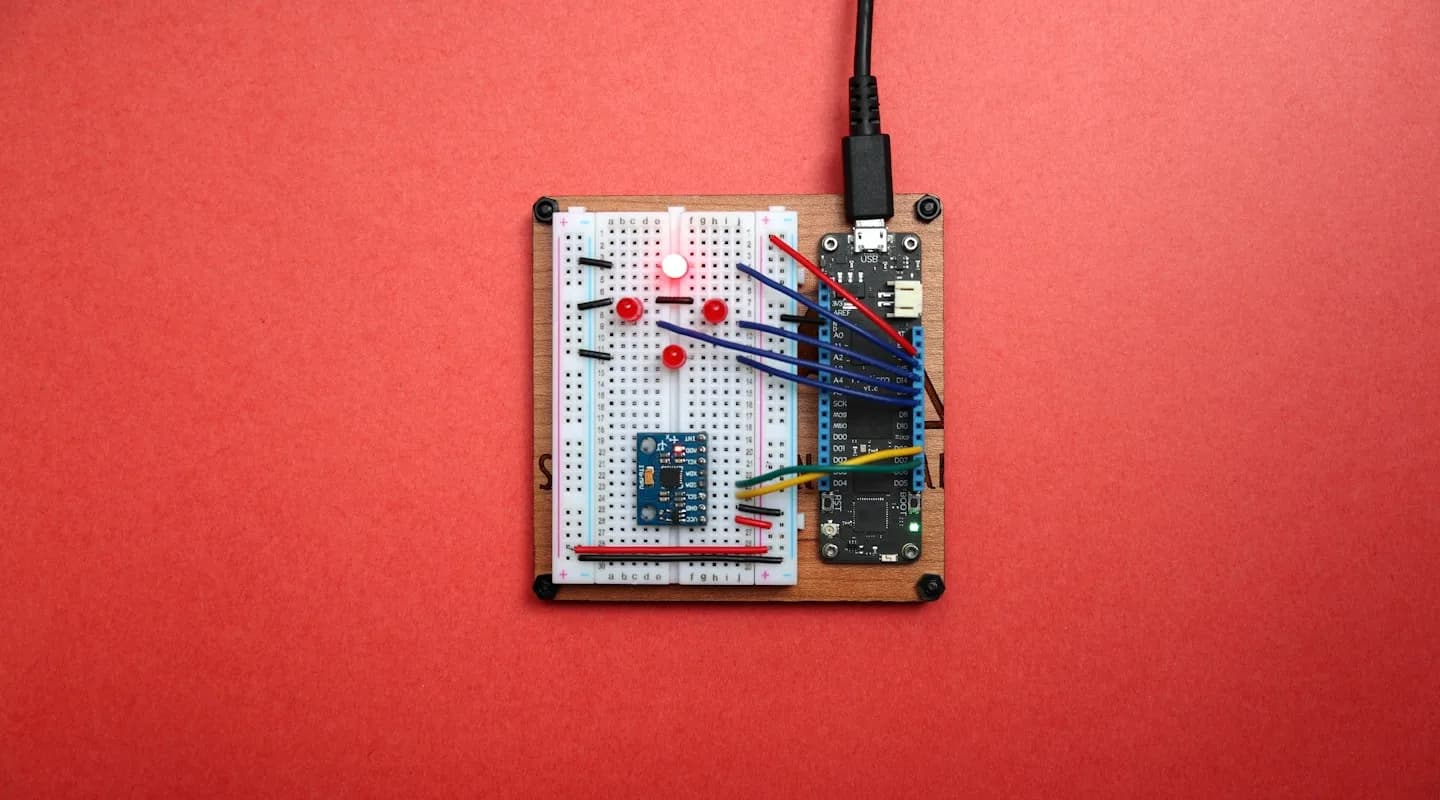 A motion sensor wired to a microcontroller on a breadboard — real sensor hardware used in robotics prototyping