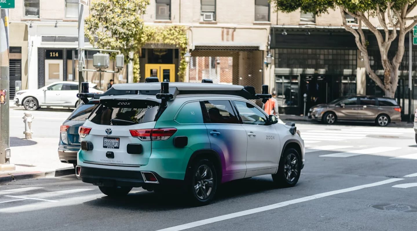 A self-driving test vehicle with multiple cameras and LiDAR sensors mounted on the roof — the sensor array used for building 3D maps